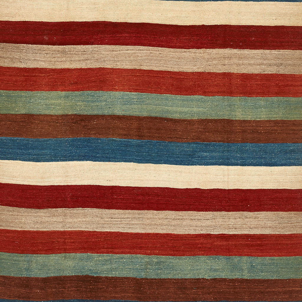 Handwoven textile with horizontal stripes in rustic earthy colors.