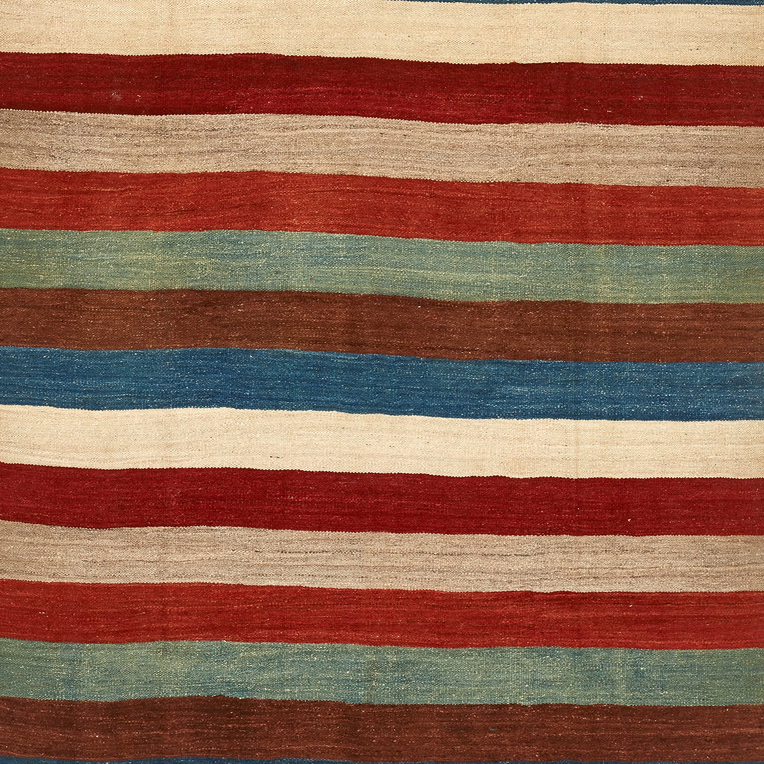 Handwoven textile with horizontal stripes in rustic earthy colors.