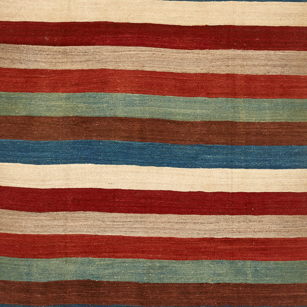 Handwoven textile with horizontal stripes in rustic earthy colors.