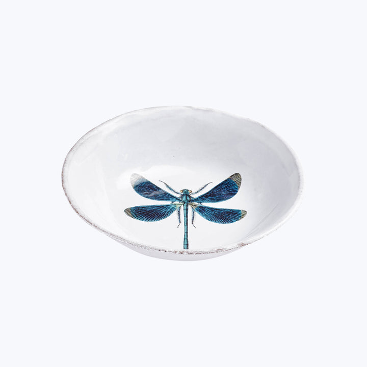 Rustic ceramic bowl with dragonfly illustration, minimalist design, blue accents.