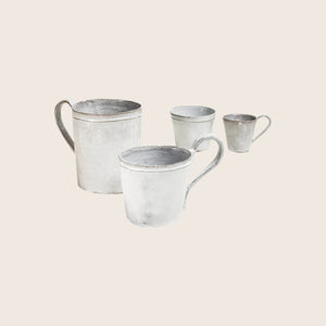 White distressed mug with simple handle on minimalistic background. - hover