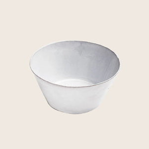 Minimalist white bowl with worn edges on isolated background surface.