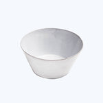 Minimalist white bowl with worn edges on isolated background surface.