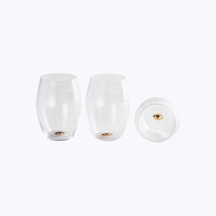 Artistic face made of transparent glasses creates optical illusion concept.