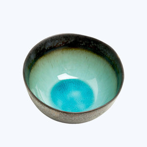 Rustic artisanal bowl with speckled exterior and crackled interior. - hover