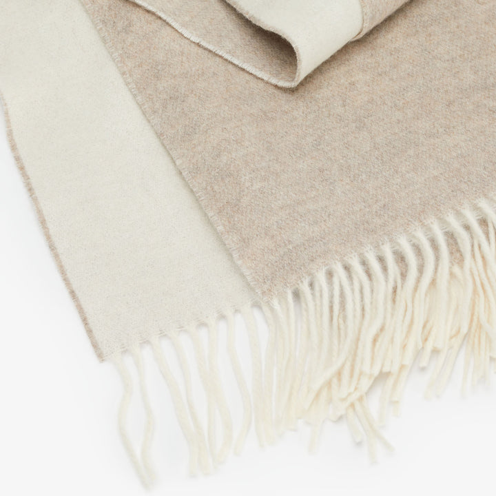 Two-tone wool scarf with fringe detail, soft and cozy texture
