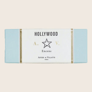 Minimalistic Hollywood-themed box with gold accents and French incense brand. - hover