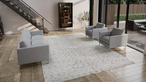 Rectangular rug with elegant floral motifs in muted gray tones. - hover