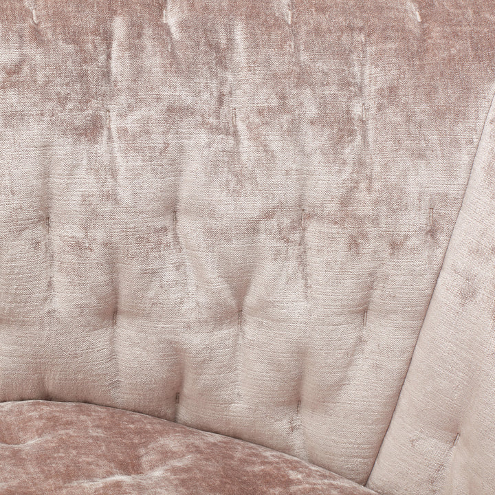 Plush, rosy-beige velvet upholstery with tufted channels on furniture piece.
