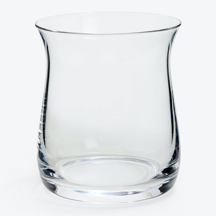 Clear glass tumbler with simple design on white background.
