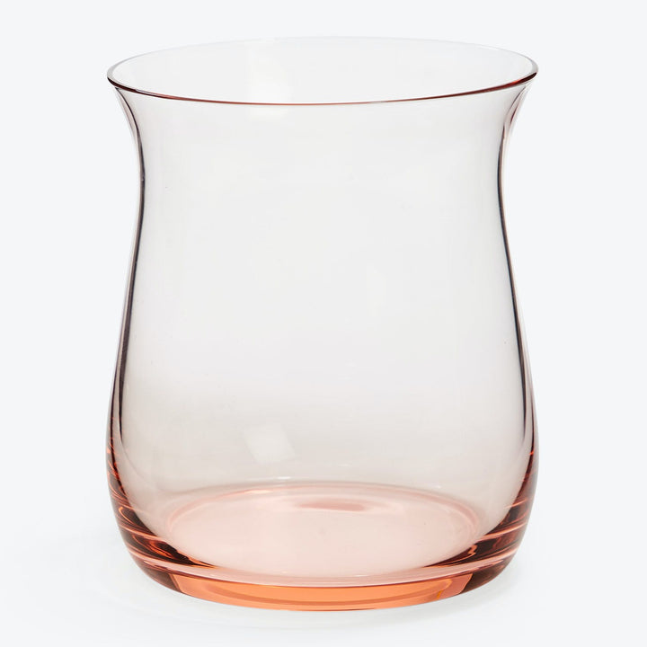 Simple, elegant glass pitcher with pink tint at base.