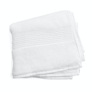 Neatly folded beige bath towel with decorative ribbed texture. - hover