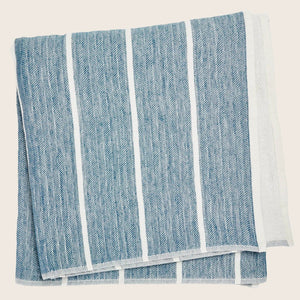 Light-colored fabric with subtle stripes neatly folded on white background. - hover