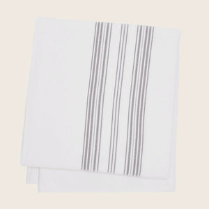 Neatly folded cloth with vertical stripe pattern on white background. - hover