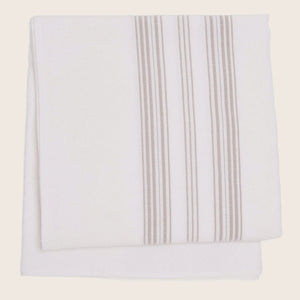 Neatly folded cloth with vertical stripe pattern on white background.