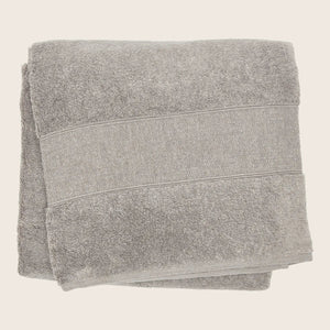 Soft gray bath towel with horizontal bands, plush texture, absorbent fabric.