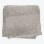 Soft gray bath towel with horizontal bands, plush texture, absorbent fabric.