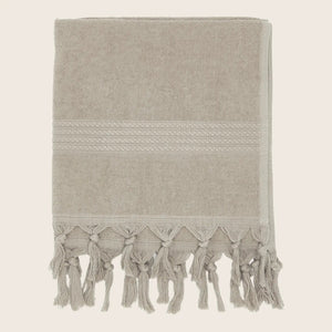 White textile with fringe, texture, and parallel lines for decor. - hover