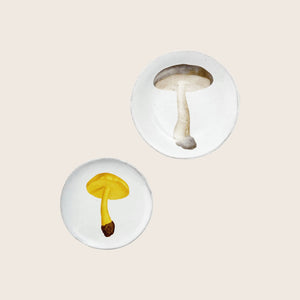 Handmade, textured white plate with a stylized mushroom design. - hover