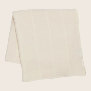 Light-colored fabric with subtle stripes neatly folded on white background.