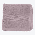 Soft, plush mauve towels with textured pattern and neat borders.