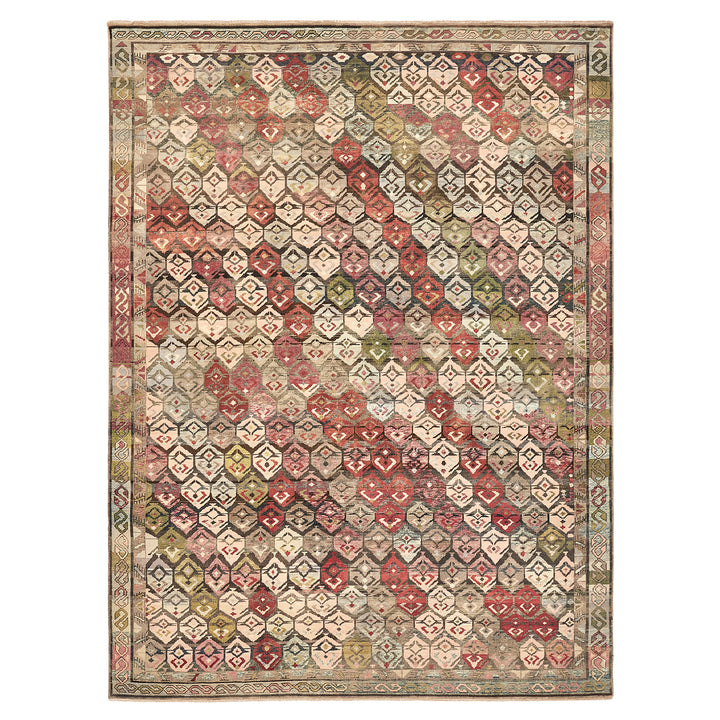 Handwoven ornate area rug with complex geometric pattern in colors.