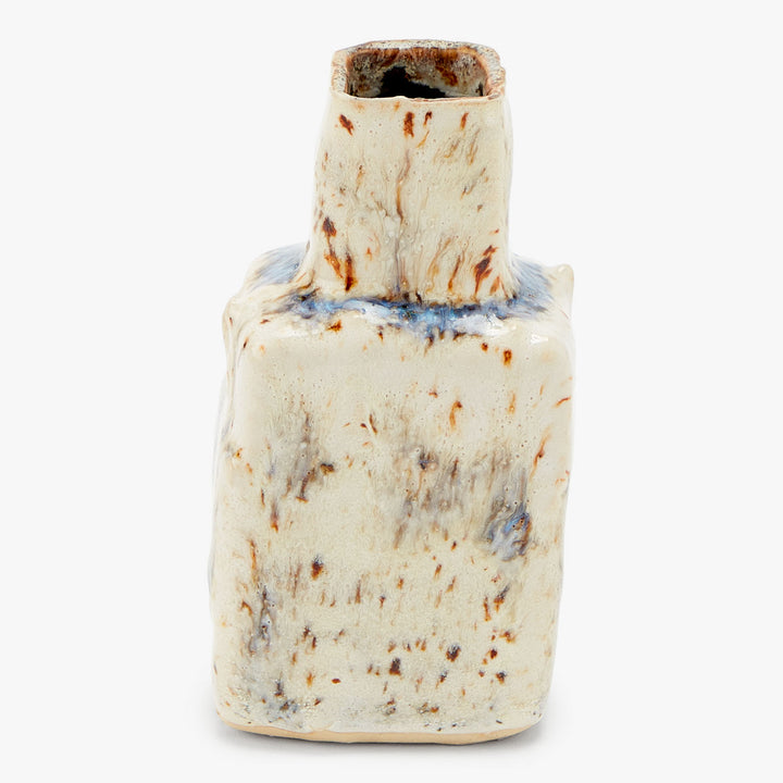 Unique ceramic vase with irregular shape and rustic glazing process.
