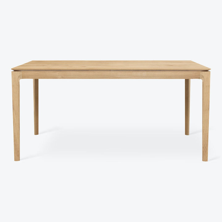Minimalist wooden table with clean lines and light finish