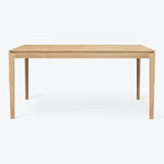 Minimalist wooden table with clean lines and light finish