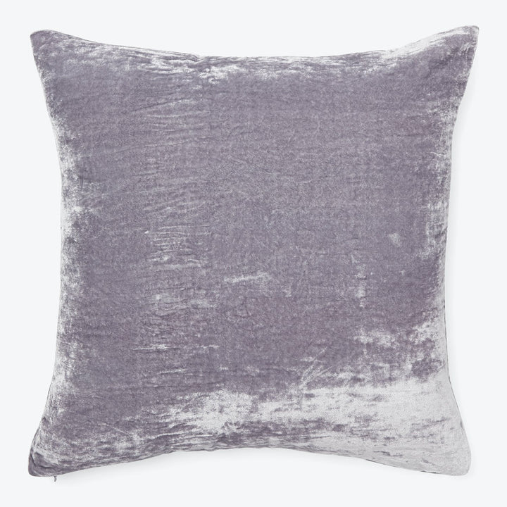 Square decorative pillow in shades of light and dark purple.