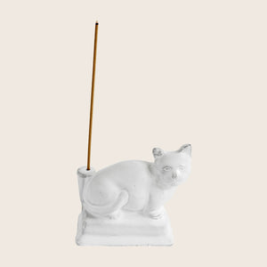 White ceramic cat figurine with glossy finish and functional design. - hover