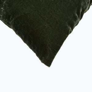 Square plush cushion with velvet-like texture in dark color. - hover