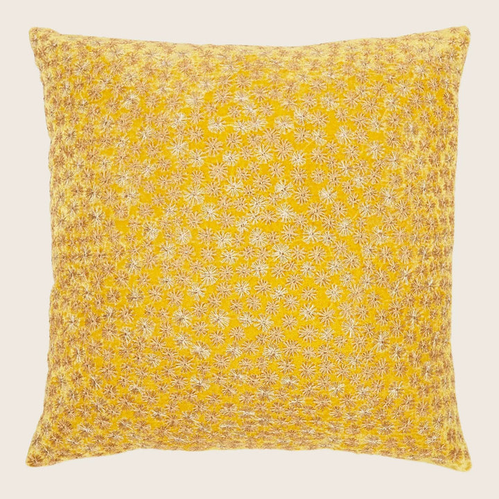 Vibrant yellow throw pillow with intricate snowflake design on white.
