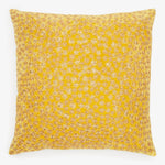 Vibrant yellow throw pillow with intricate snowflake design on white.
