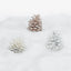 Frosted pinecones in winter colors for festive holiday decor display.