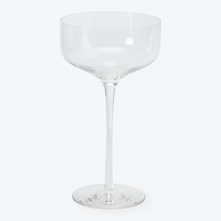 Empty wine glass on white background, featuring elegant stem design.