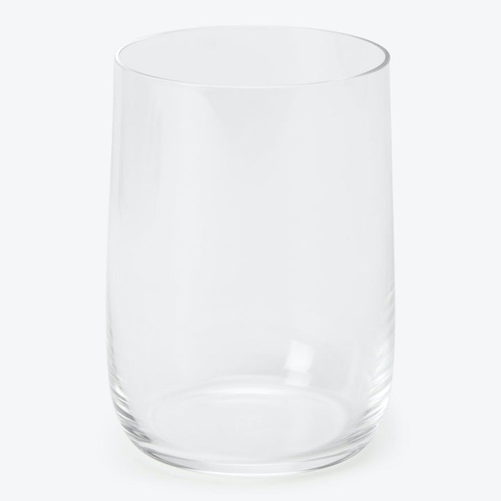 Simple, clear glass with cylindrical shape on light background.