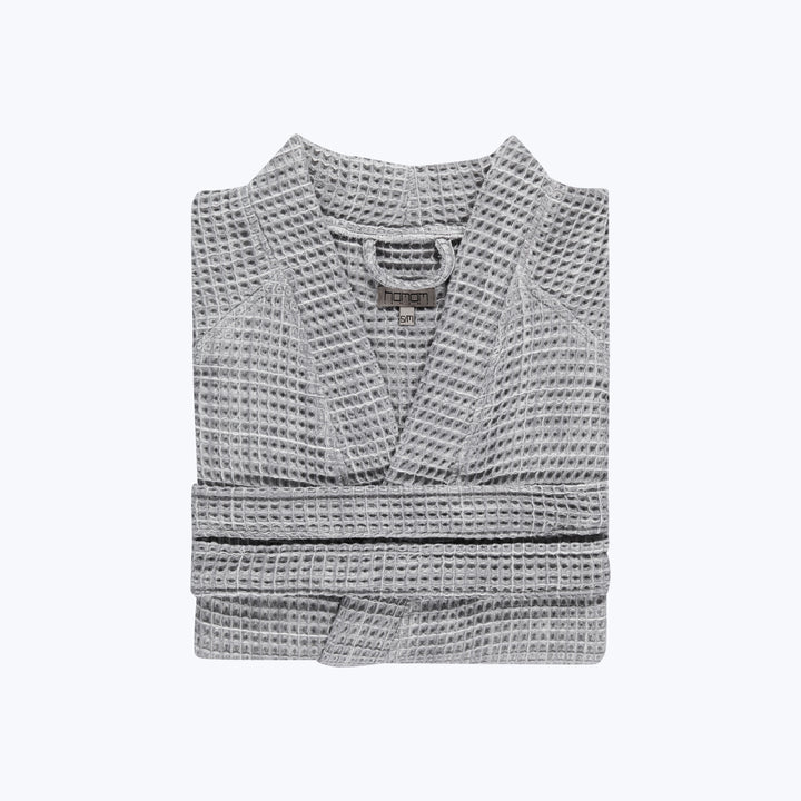 Gray waffle knit sweater with crew neck, cozy and stylish.