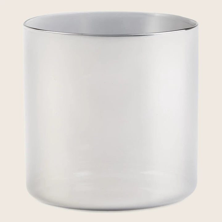 Silver cylindrical container with minimalist design against white background.