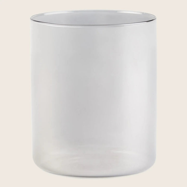 Minimalist metallic cylindrical pot with modern design and versatile use.