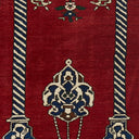 Colorful textile with intricate floral and geometric motifs on rug.