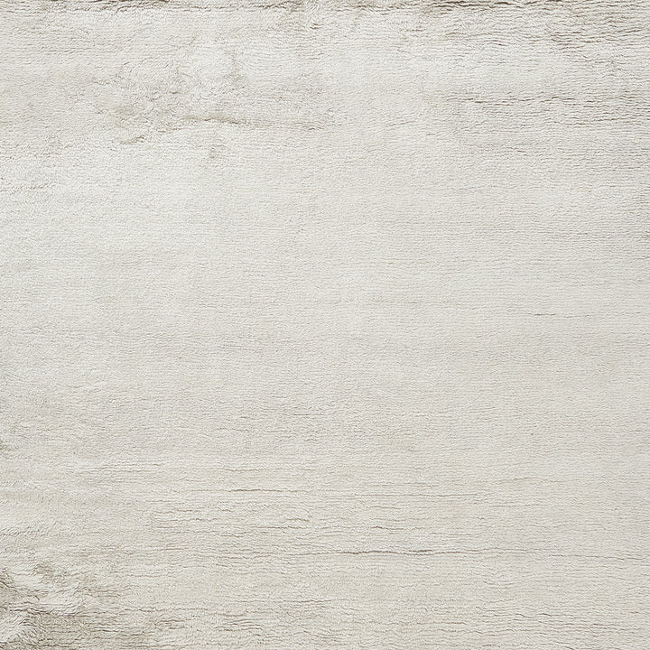 Minimalist light cream textured surface with subtle depth variations.