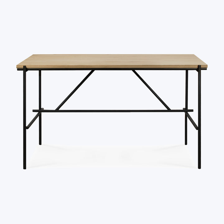 Modern minimalist desk with metal frame and light wood finish.