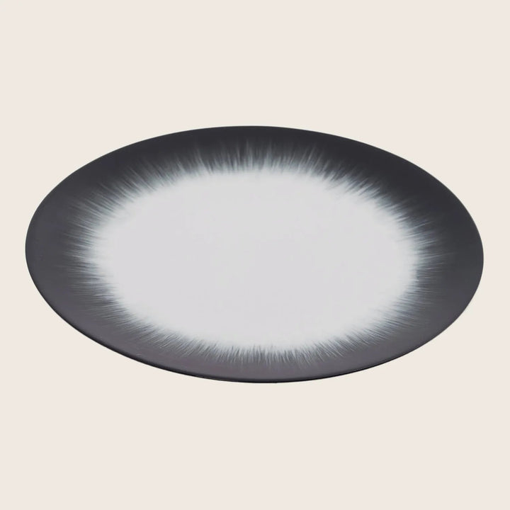 Stylish round plate with gradient colors and modern design.