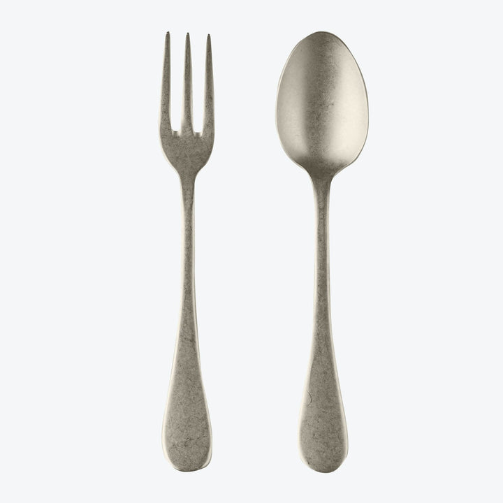 Metal fork and spoon with matching design on plain background.