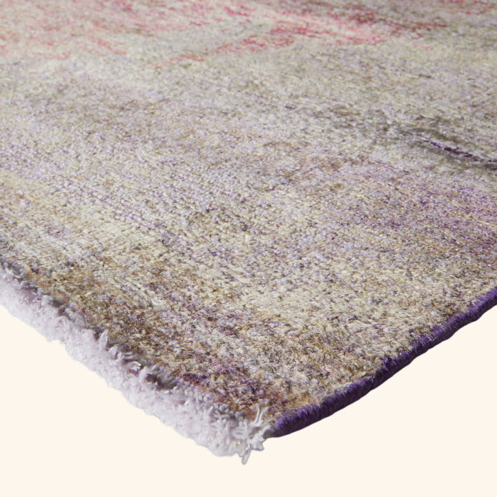 Colorful, plush area rug with lustrous sheen and abstract design.