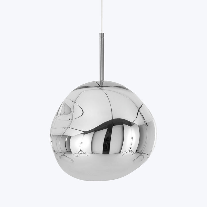 Modern chrome pendant light with mirror-like finish in stylish interior.