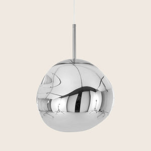 Modern pendant light with metallic finish and distorted reflections. - hover