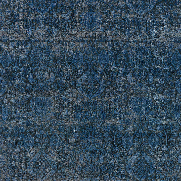 Intricate blue fabric or wallpaper pattern with floral motifs. Luxurious.