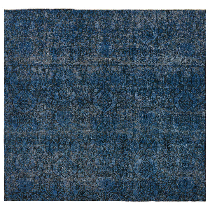 Intricate blue patterned area rug with vintage distressed look.